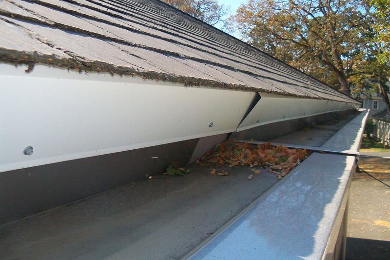 Repaired metal gutter on a historic building