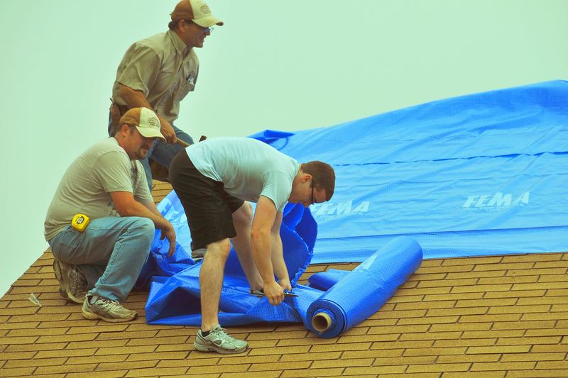 Temporary roof repair with tarps